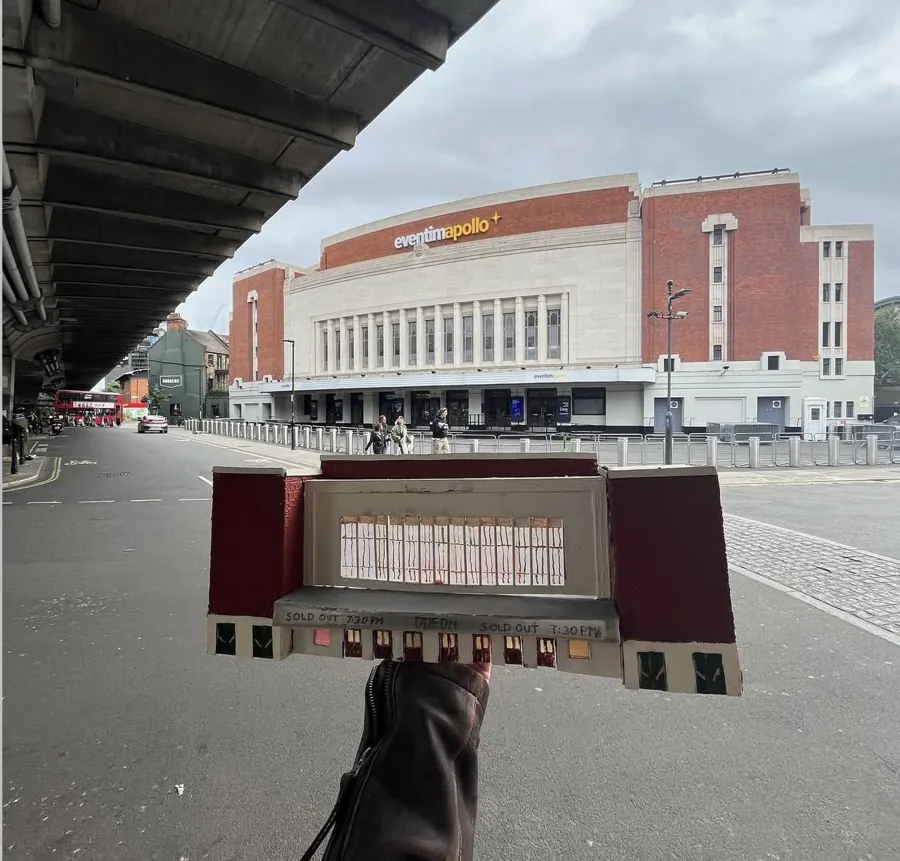 Miniature Apollo theatre held in front of the real building