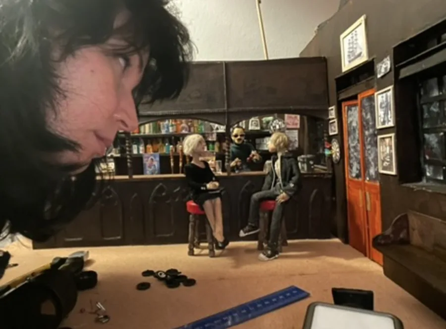 Animator working beside the miniature set